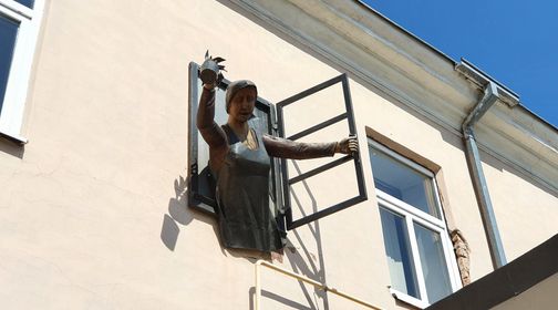 Sculpture Woman in the Window